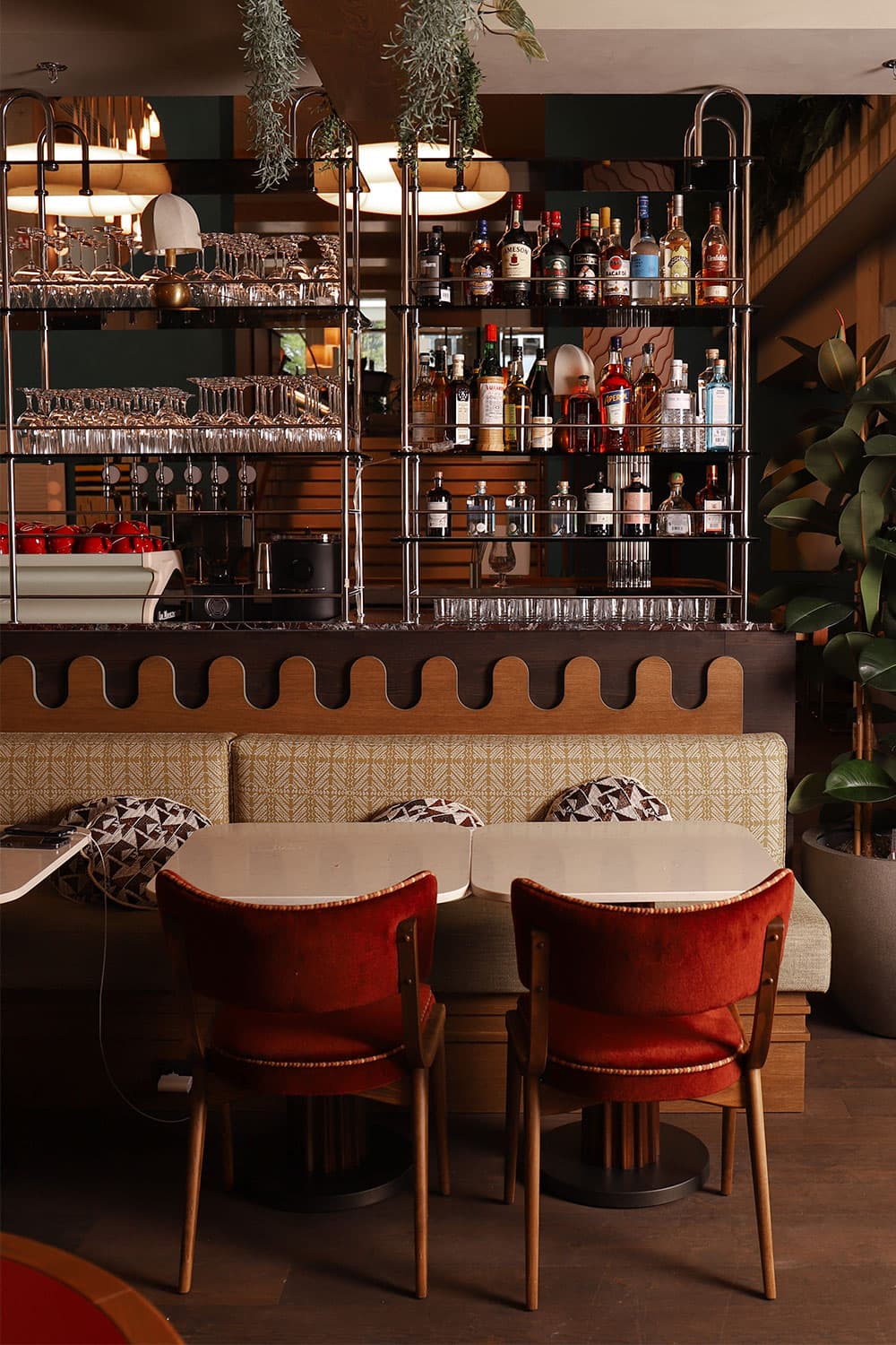 A fully-stocked cabinet of wines and spirits behind the bar at Cantina Valentina.